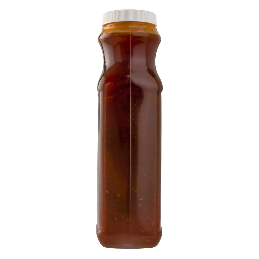 Bottle of bloody mary mix with a white cap on a white background